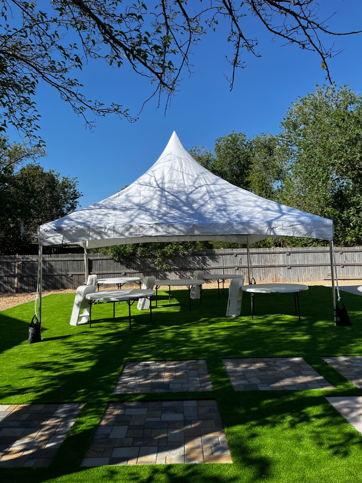 20x20 high peak tent package with round tables and chairs
